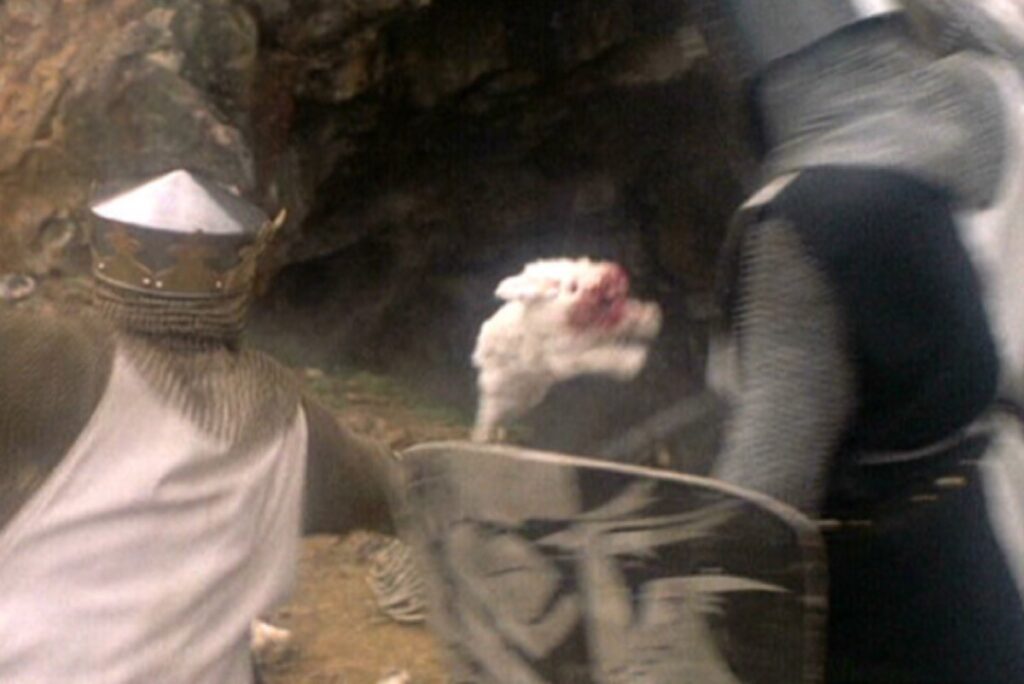 shot of a white bunny leaping aggressively at a knight in medieval armor