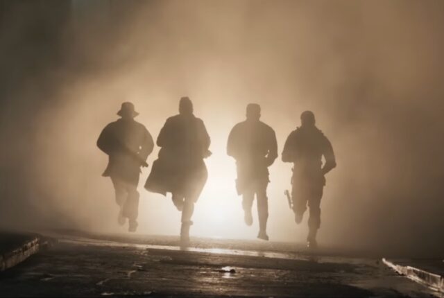 Figures armed and running towards the camera.