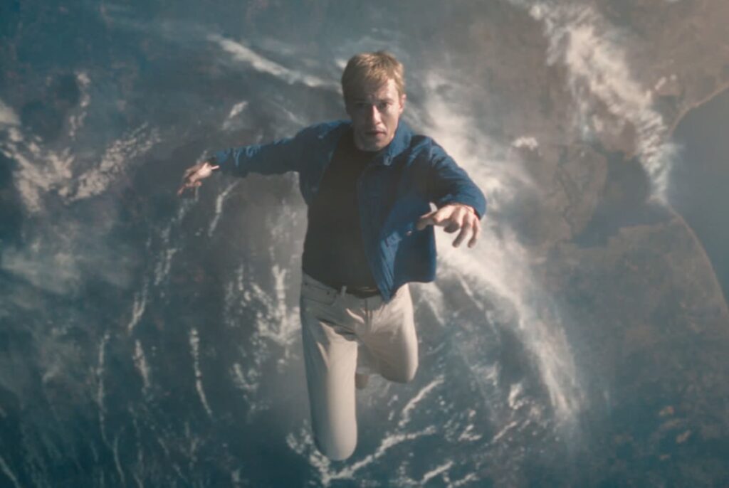 Johnny Storm shares a moment with the Silver Surfer in Earth's atmosphere.